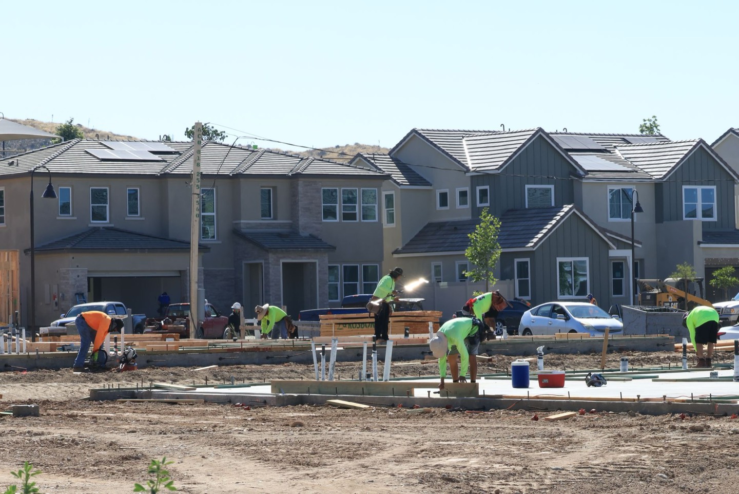 A row of newly built two-storey homes in a growing suburban subdivision.